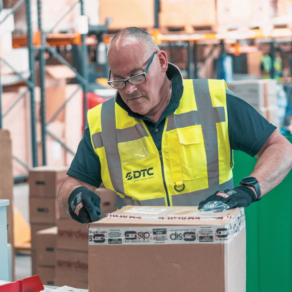 Warehouse Operative Unpacking Box